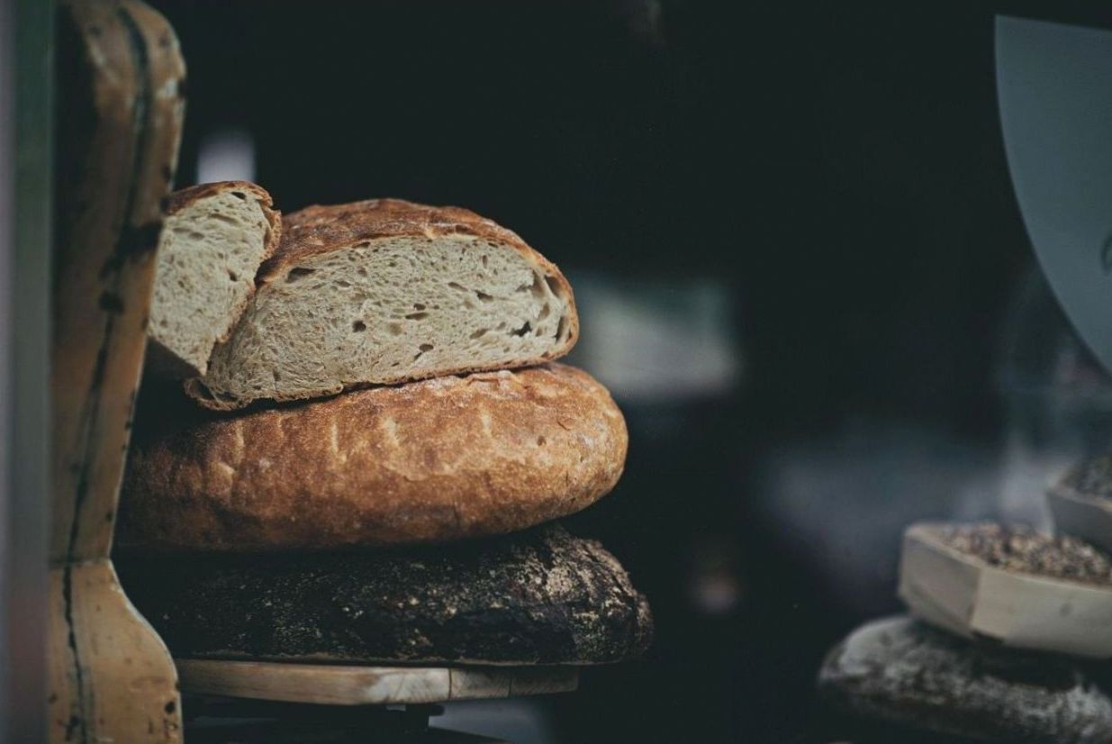 Fresh sourdough and pastries on a bakery counter