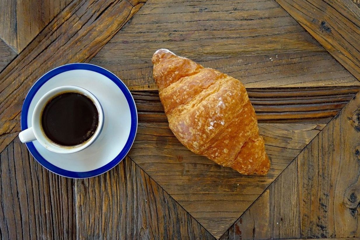 Breakfast pastry and coffee